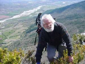 Denny gets to the top of another hard climb. with the house and the Buech river below